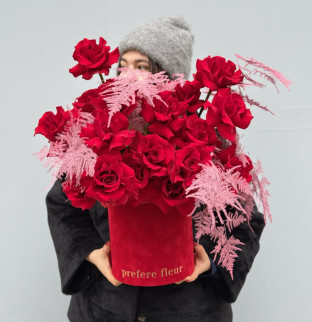 A bouquet of red roses with asparagus in a box A bouquet of red roses with asparagus in a box