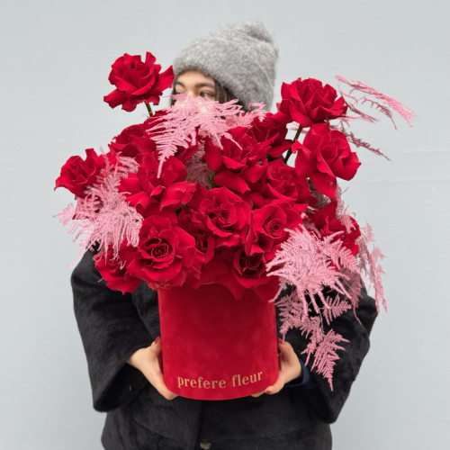 A bouquet of red roses with asparagus in a box A bouquet of red roses with asparagus in a box